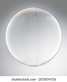 Bubble made from bleach with bleach drizzling inside sphere - Shutterstock ID 2073074726