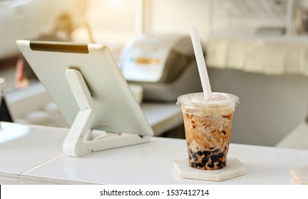 Bubble Milk Tea Background, Food And Drink Background. Using A Smartphone In A Beverage Shop.