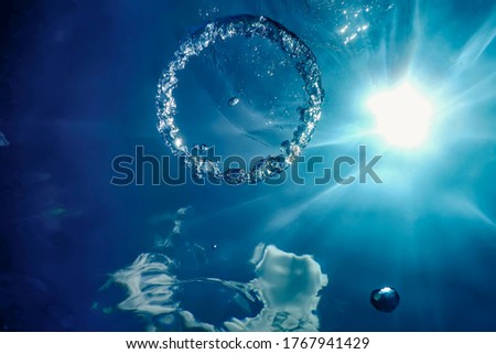Bubble Ring Underwater ascends towards the Sun.