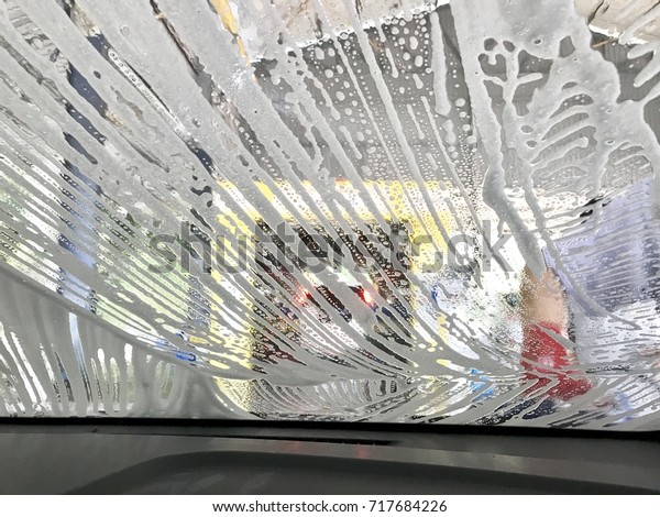 Bubble soap at car window\
in car wash