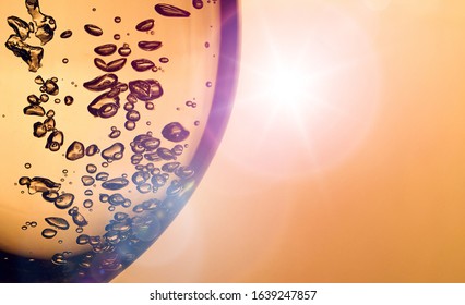 A bubble splash of transparent clear water liquid in glass at sunlight. wineglass with bubbles. Water in glass. Fresh water