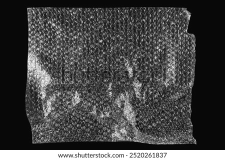 Bubble wrap background, plastic texture design. Transparent bubble wrap on black background, top view