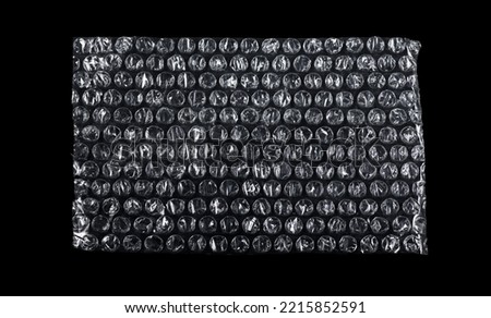 Bubble wrap texture isolated on black background. Packaging