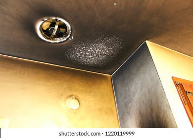 Bubbled and smoked up ceiling after a kitchen fire - Shutterstock ID 1220119999