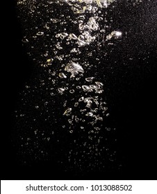 Bubbles With Air In Water On A Black Background