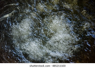 Bubbles Boiling Transparent Hot Water On A Close Up Still Of A Silvered Gray Pan.