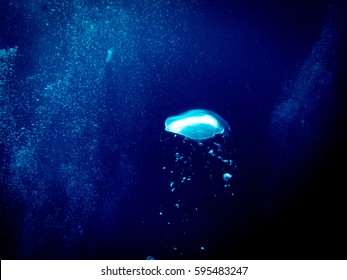 Bubbles From Divers In The Deep Ocean