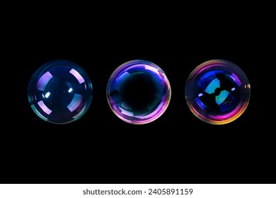 BUBBLES ISOLATED ON BLACK BACKGROUND, LIGHT GLOWING SOAPY RAINBOW SPHERES ON DARK