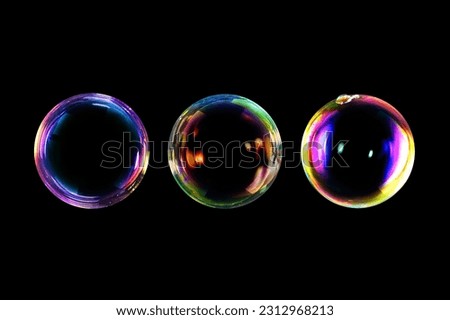 BUBBLES ISOLATED ON BLACK BACKGROUND, CLEAN BACKDROP