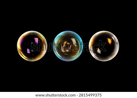 BUBBLES ISOLATED ON BLACK BACKGROUND, AIR BUBBLES ON DARK BACKDROP, LIGHT GLOWING SPHERES BACKGROUND, SET OF THREE BLOWN WATER BUBBLES