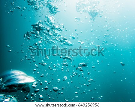 Bubbles in ocean. Water texture in underwater