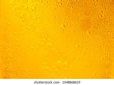 Bubbles On Beer Background. Oil Drop Shape On Yellow Background.Golden Circle Bubble Water Pattern.