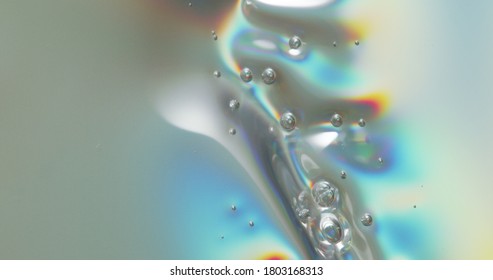 Bubbles On Melting Plastic. Bubbles Forming Across A Melting Plastic Surface.