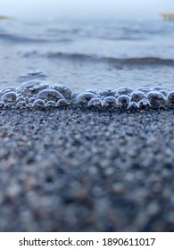 Bubbles and small waves at the beach