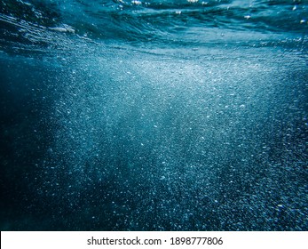 Bubbles Under The Sea In The Crystal Clear Green Sea Water. Mediterranean Bubbles. Real Image Very Suitable For Backgrounds	