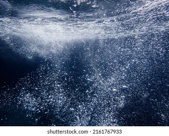 Bubbles Under The Sea In The Crystal Clear Green Sea Water. Mediterranean Bubbles. Real Image Very Suitable For Backgrounds, Rising Bubbles In Deep Underwater, Under With Bubble. Great For Background.