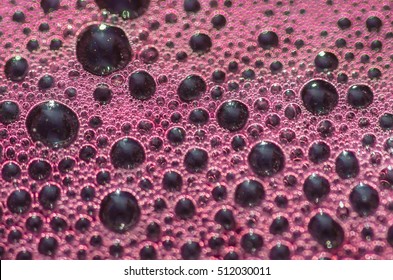 Bubbles the wort red wine during fermentation, closeup, background