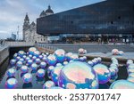 Bubblesque light installation on the Liverpool waterfront seen as part of the River of Light festival in Liverpool on 29 October 2024 featuring giant bubbles floating on the water.