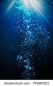 BUBBLING WATER  BACKGROUND WITH SUN LIGHT RAYS SHINING, STREAM OF UNDERWATER BUBBLES