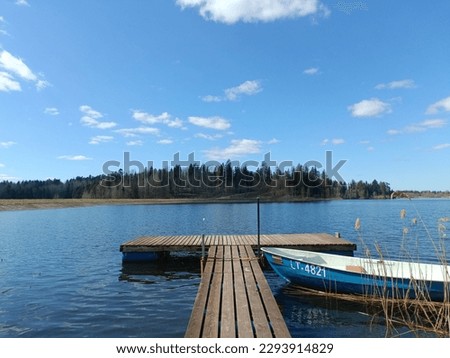 Bubiai lake during sunny day. Lake with small waves. Sunny day with white and gray clouds in sky. Early spring day. Nature. Bubiu ezeras.
