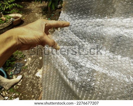 Buble pack plastic waste surface with textures as background 2d assets or 3 d assets, wallpaper, journalistic photography or article images