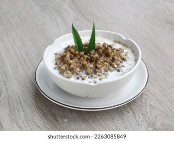 Bubur kacang hijau (mung beans sweet porridge) is popular and healthy Indonesian dessert made with mung beans are boiled till soft, sugar, pandan leaves and coconut milk are added. selected focus 
