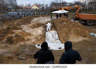 Bucha, Kyiv Oblast, Ukraine 11-04-2022 A Clandestine Grave Was Found Behind The Church In The Town Of Bucha, Forensic Experts Are Working On The Site To Dig Up The Bodies.
