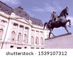 Bucharest, capital city of Romania. Central University Library and statue of king Carol I of Romania.