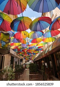 Bucharest, Romania, 08/04/2020: Colorfull Umbrella Path In Bucharest.