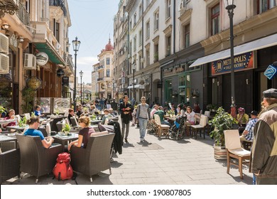 BUCHAREST, ROMANIA - APRIL 26: People enjoy spring time downtown Lipscani Street on April 26, 2014 in Bucharest, Romania. Lipscani is one of the most busiest streets of Bucharest.
