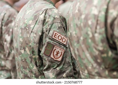 Bucharest, Romania - April 28, 2022: Shallow depth of field details with an EOD armband (brassard, armlet) on the uniform of a Romanian soldier.