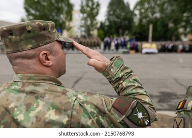 Bucharest, Romania - April 28, 2022: Romanian Land Forces Soldier Salutes During A Public Ceremony.