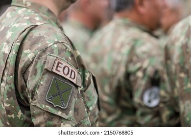 Bucharest, Romania - April 28, 2022: Shallow depth of field details with an EOD armband (brassard, armlet) on the uniform of a Romanian soldier.