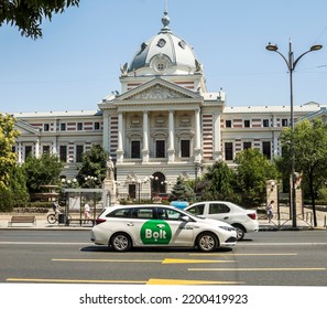 Bucharest, Romania Aug. 2022 Modern City Taxi Cab Car With Bolt Online Internet Taxi Transportation Service Side Markings On Street At Bucharest City Center