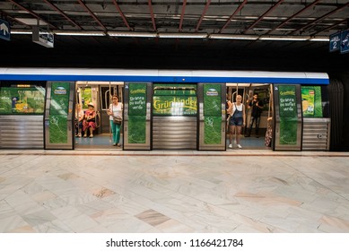 Bucharest, Romania - August 15, 2018. People inside a train at a metro station in central Bucharest.