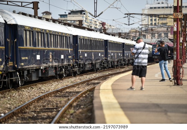 BUCHAREST, ROMANIA - AUGUST 29, 2022: Famous\
Orient Express long distance passenger train stopped in Bucharest\
central train\
station.