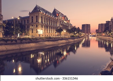 Bucharest, Romania -August 4, 2015: Dimbovita River and the Justice Palace in Unirii Square.