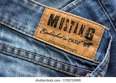 BUCHAREST, ROMANIA - CIRCA 2020:   Mustang back patch on a pair of jeans. Mustang is a German jeans brand.