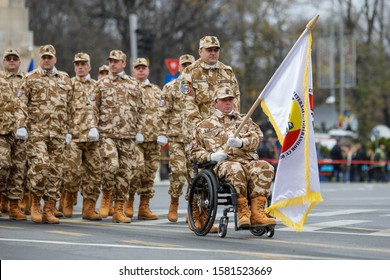 Bucharest, Romania - December 01, 2019: Romanian Army Veteran Soldiers, Injured And Disabled (one Sitting In A Wheelchair) Take Part At The Romanian National Day Military Parade.