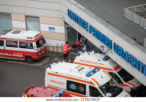 Bucharest, Romania -\
December 03, 2019: Ambulances, medics and nurses on the entrance of\
the emergency department (ER) of the Bucharest Emergency University\
Hospital.