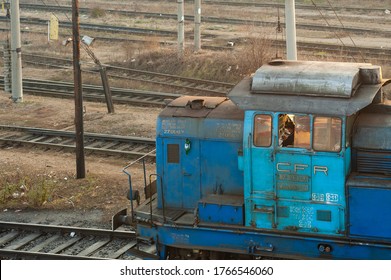 Bucharest / Romania - December 3, 2011: Locomotive Train Driver At The End Of His Shift Writing Down In The Journal In The Triage Of North Station.