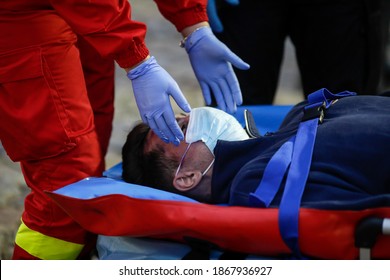 Bucharest, Romania - December 5, 2020: Paramedics From The Romanian Ambulance (SMURD) Exercise The Rescue Of A Car Crash Victim.