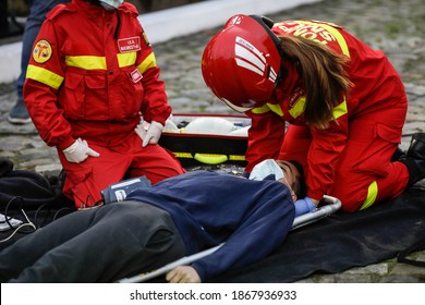 Bucharest, Romania - December 5, 2020: Paramedics From The Romanian Ambulance (SMURD) Exercise The Rescue Of A Car Crash Victim.