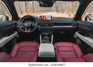 Bucharest, Romania - February 24 2021: Mazda CX-5 100th Anniversary edition interior view cockpit, steering wheel and buttons details