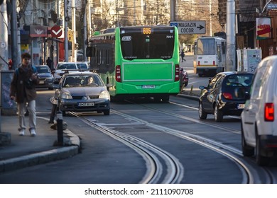 Bucharest, Romania - January 05, 2022: A public transport bus Mercedes Citaro Hybrid is driven in traffic on a boulevard in Bucharest.This image is for editorial use only.