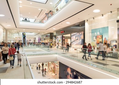 BUCHAREST, ROMANIA - JULY 08, 2015: People Crowd Rush In Shopping Luxury Mall Interior.