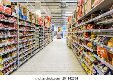 BUCHAREST, ROMANIA - JULY 09, 2014: Junk Food For Sale In Supermarket Aisle.