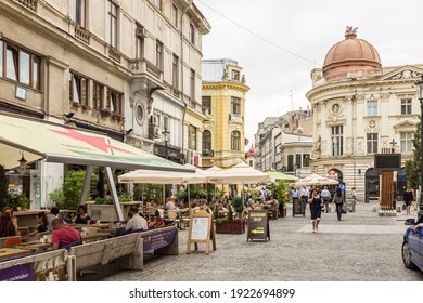 Bucharest, Romania - July 8, 2013: Outdoor dining and restaurants lining a street in central Bucharest, Romania