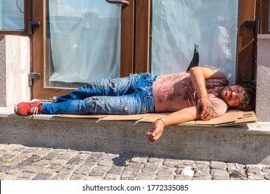 BUCHAREST, ROMANIA - JUNE 22, 2018: Homeless Man Sleeping In Bucharest In A Summer Day