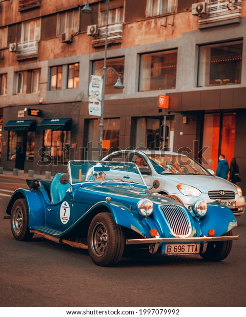 Bucharest,
Romania - June 25 2021: Photography of a lady driving her Morgan
vehicle on Calea Victoriei during
sunset